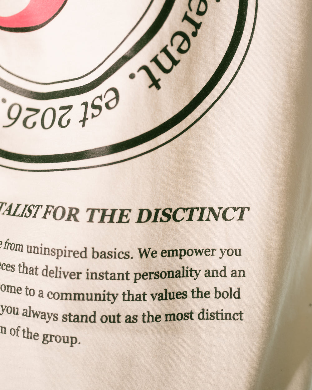 Close-up of the typo on the Happy Accident Tee